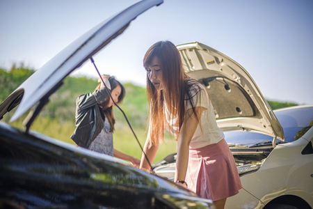 woman worry in about damaged of the car after car crash by accidentの写真素材