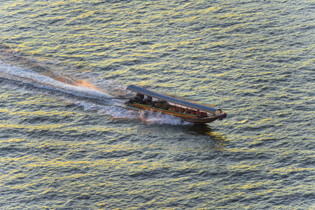 small ferry boat running across the riverのeditorial素材