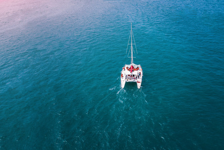 Yachting boat sailing alone in tropical seaの写真素材