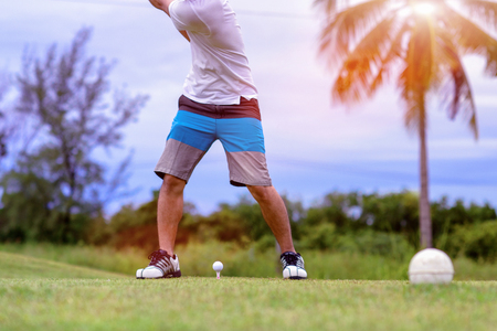 golf ball on the tee-off ready to impact by the hit of golfer after Addressing the ball in square and proper stance to the fairway forwardの写真素材