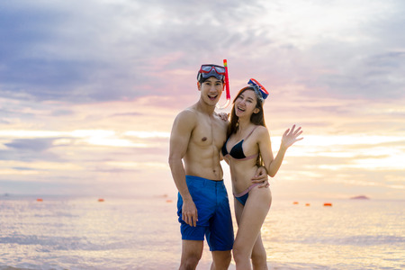 Happy Couple lover enjoy and have fun on Tropical Beach at Sunset, Vacation holidayの写真素材