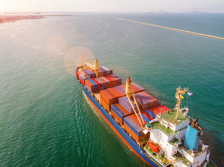 container ship under sailing middle of the sea proceeding to the port, carriage the shipment under...