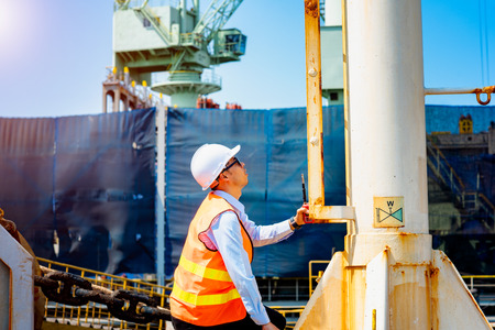 foreman, supervisor, inspector, worker, engineering works on duty for checking safety, security system to ensure the industrial jobs done under regulation rule, works at risk & high level of insuranceの写真素材
