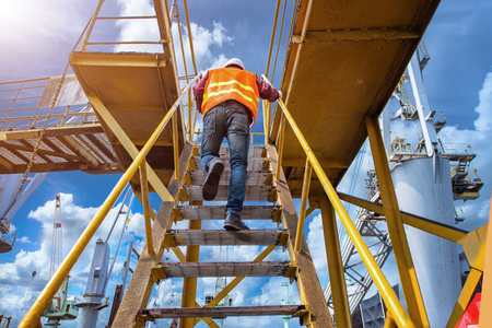 worker, engineering wearing safety shoe with set of safety and security regulation, walking in mind...