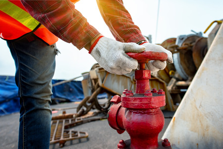 Close up hand opening or closing water valve in fire fighter in jobsite  during training or inspecting,  Fire fighting checking in safety priorityの写真素材