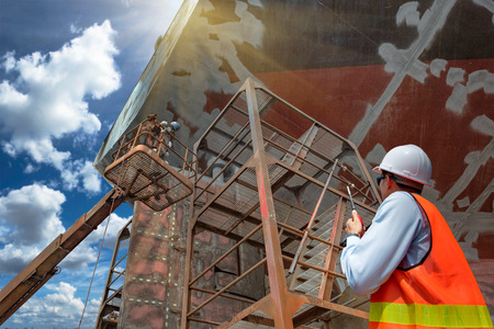 foreman, supervisor, communination to worker or power man of painting gans or brush man in cherry...