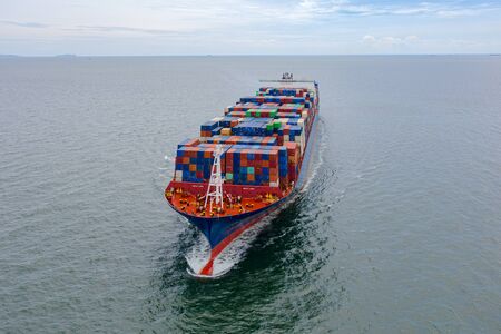 the large TEU container ship sailing in the sea carriage the shipment cargo from loading port to...