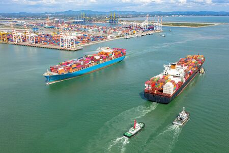 top aerial view of the large TEU containers ships arrival and departure the port, carriage the...