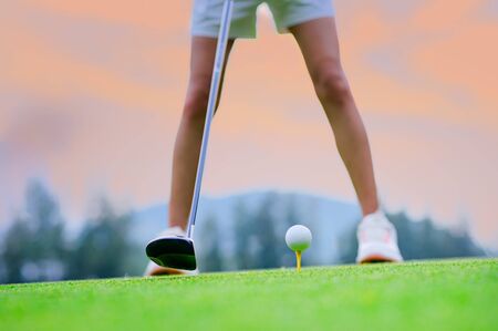 wood driver being backswing ready to hit golf ball away to destination on the fairway for best winning scoreの写真素材
