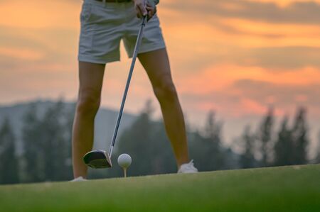 golf ball on TEE-OFF beingprepare ready to hit away to fairway destination by player, concentrate to hit to fairway in best shotの写真素材