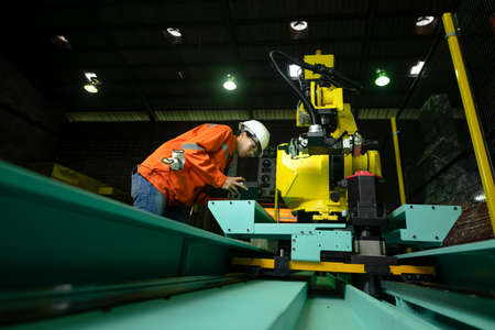 woman working engineering or technical inspection the system  of machinery to ensure working in order by checklist part and quality controlの写真素材