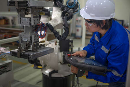 supervisor inspect or testing the system of robotic brand new in smart factory modern, working...