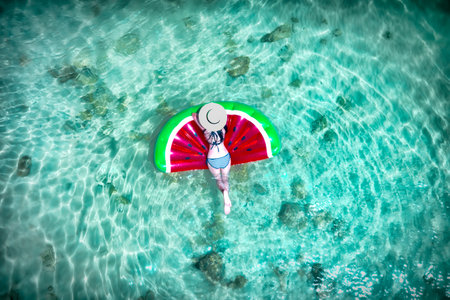 woman in bikini enjoy swimming on inflatable tube at the sea island, summertime enjoyment in the sea...
