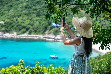 Traveler tourist in action of enjoy the trip sightseeing the sea summer nature in island popular visit on Kohtao of Thailandの写真素材