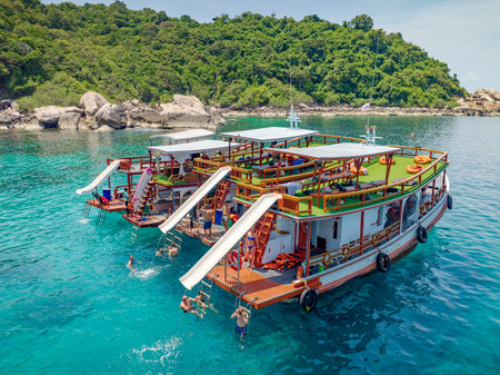 Top aerial view of  natural bay serving ton of traveler tourist  take bundle of tour boats dropped anchorage let people enjoy water sport together  in summertime Thailand travel and visitingの写真素材