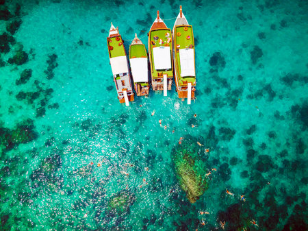 Top aerial view of  natural bay serving ton of traveler tourist  take bundle of tour boats dropped anchorage let people enjoy water sport together  in summertime Thailand travel and visitingの写真素材