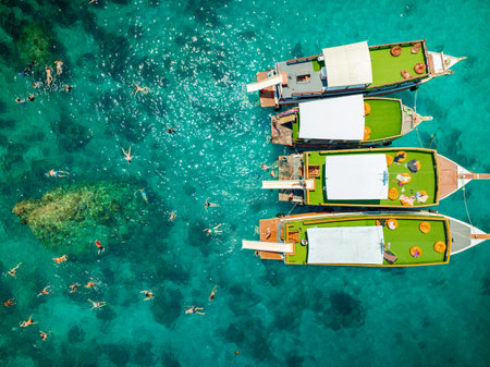Top aerial view of  natural bay serving ton of traveler tourist  take bundle of tour boats dropped anchorage let people enjoy water sport together  in summertime Thailand travel and visitingの写真素材