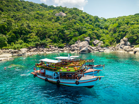 Top aerial view of  natural bay serving tons of traveler tourists take bundles of tour boats dropped anchorage let people enjoy water sport together  in summertime Thailand travel and visitingの写真素材