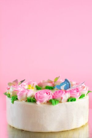Butter cream of Pink Roses decorated oo vanilla pond cake on pink background with copy space served in Birthday Party and wedding. Delicious sweet bakery for someone you love.の写真素材