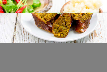 Thai northern herb sausage sliced on white dish on table with copy space for your text. Thai food concept.の写真素材
