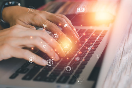 Hi-tech of business and financial concept. Hand typing keyboard of laptop with virtual business...