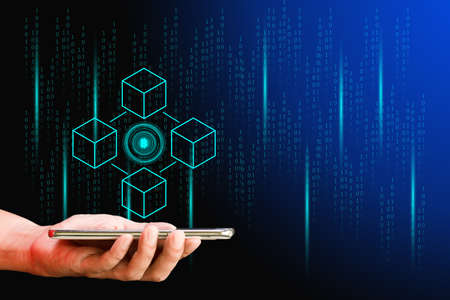 Business and technology concept. Hand smartphone with cryptocurrency coin and blockchain technology on binary code black background. Big data information exchanges digital currency and online payment.の写真素材