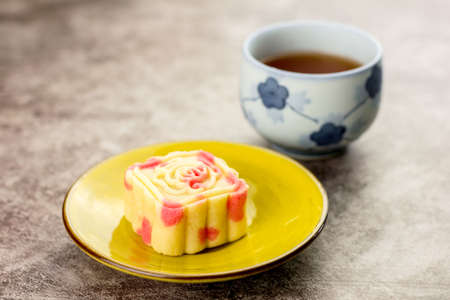 Close up, Homemade bakery concept. Delicious pineapple cookies look like mooncake on yellow plate with copy space.の写真素材