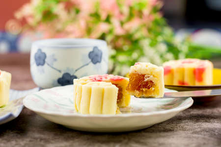 Close up, Homemade bakery concept. Delicious cutting pineapple cookies look like mooncake on white plate with copy space.の写真素材