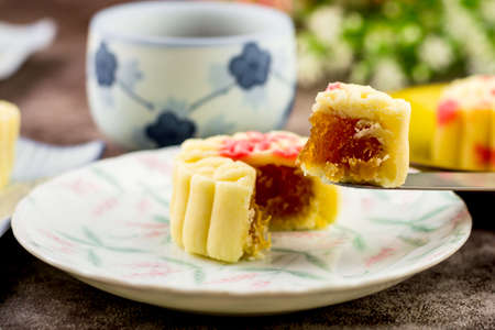 Close up, Homemade bakery concept. Delicious cutting pineapple cookies look like mooncake on white plate with copy space.の写真素材