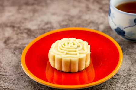 Close up, Homemade bakery concept. Delicious pineapple cookies look like mooncake on red plate with copy space.の写真素材