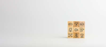 Metaverse concept. Wooden block with icons of metaverse such as learning, music, NFT, blockchain, AR, and VR 3D, online synchronize.の写真素材