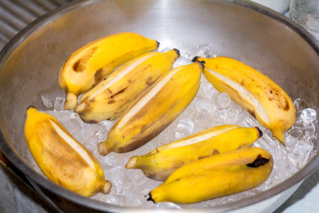 Yellow peel banana on ice and cold water.の写真素材