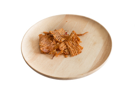 dry squid on the wood plateの写真素材