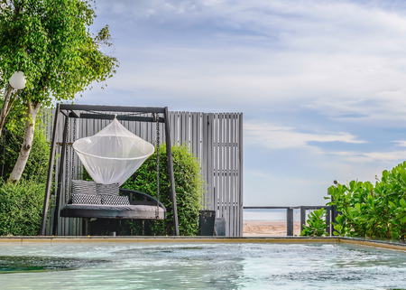 swing on the pool for relaxationの写真素材