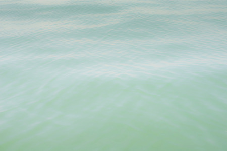 sea texture on green tone for any work background.の写真素材