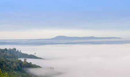 Sea fog over the hill in the morningの写真素材