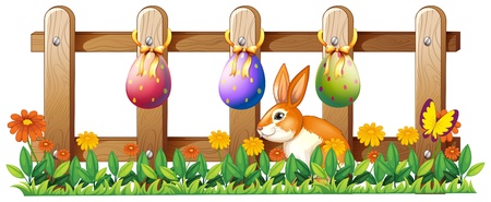 Illustration of the Easter eggs at the fence and a bunny on a white backgroundのイラスト素材