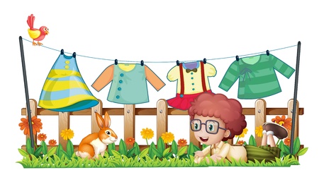 Illustration of a boy and a bunny in a garden with hanging clothes on a white backgroundのイラスト素材