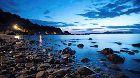 A breathtaking sight of a coastal cliff under a starry night sky, the Milky Way reflected on the calm sea.の素材