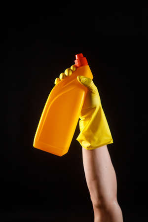 cleaning products, yellow toilet for hands with yellow rubber gloves.の写真素材