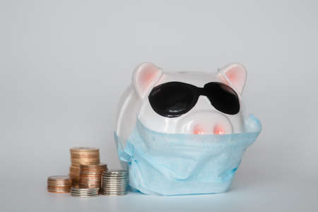 the collapse of financial markets and the danger to financial savings due to a pandemic virus.masked...