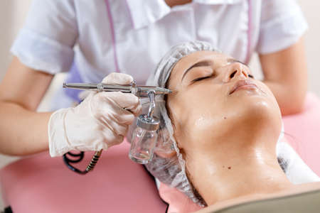 cosmetology beauty clinic.Professional cosmetologist conducts cell oxygenation for the face Ozone...
