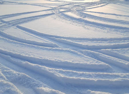 Texture of the snow is a snowdrift in backlighting. Falling small snowflakes in backlighting. Abstract rack of the car. Selective focus.の写真素材