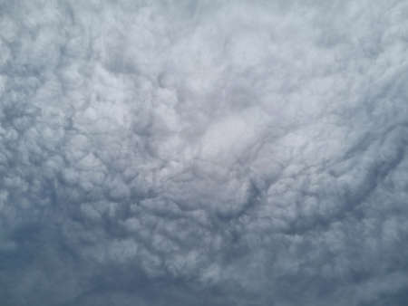 Nature, in front of a stormy sky cloud, stratus cumulus rain clouds. Anxious mood. For backgroundの写真素材