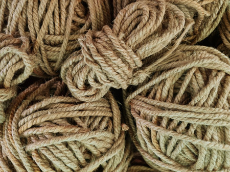 Tangled coarse linen ropes. Texture for the background. Selective focus