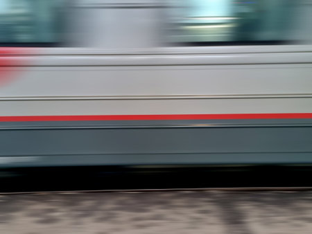 Close-up of a train moving on the street in motion blur
