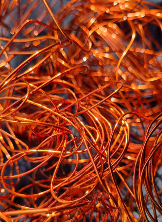Copper wire on the black background, closeup of photo.の写真素材