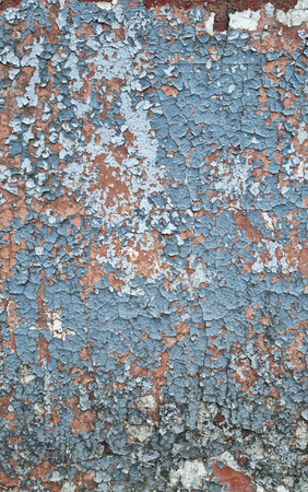 Texture of old rustic wall covered with gray and blue stucco. Multilayers of old paint on the wall. Textured background.の写真素材