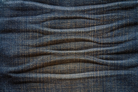 Textured creased denim striped jeans backgroundの写真素材