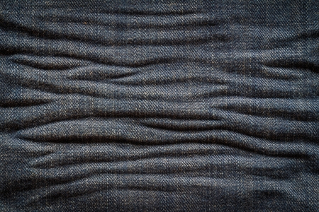 Textured creased denim striped jeans backgroundの写真素材